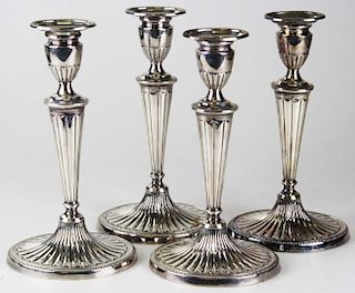 set of 4 Sheffield Adam design weighted silver candlesticks, ht 10 3/4”
