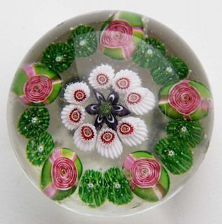 Clichy five rose art glass paperweight with 6 point star center 1.75" dia- some surface nicks