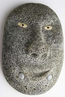 Inuit whale bone mask with walrus ivory eyes, small soapstone accents, ht 8.5”