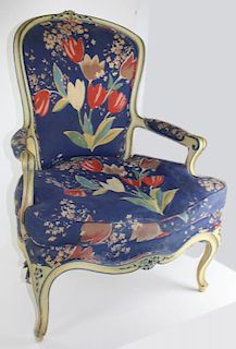 Louis XV style carved upholstered arm chair in blue and white paint. Early 20th c.