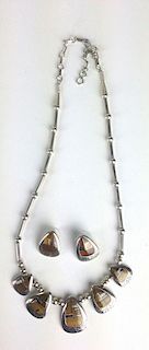 Southwest Navajo sterling necklace and pair of earrings inlaid with various hard stone. Signed Teme