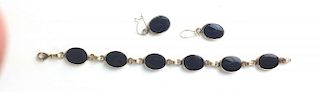 14k y.g. bracelet having 6 oval bezel set onyx and polished stones each 15mm x 12mm. 7"l with pair m