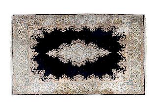 A Kerman Wool Rug, 9 feet 10 inches x 13 feet 9 inches.