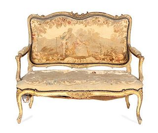 A Louis XV Giltwood Canape, Height 37 x width 43 1/2 x depth 22 inches.