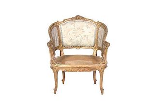 A Louis XV Style Carved Giltwood Bergere, Height 33 1/2 inches.