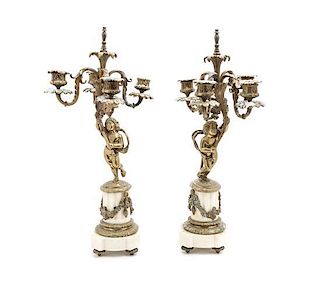 A Pair of Napoleon III Gilt Metal and Marble Figural Four-Light Candelabra, Height 19 1/4 inches.