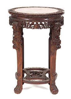 A Chinese Carved Hardwood and Marble Side Table, Height 32 x diameter 24 inches.