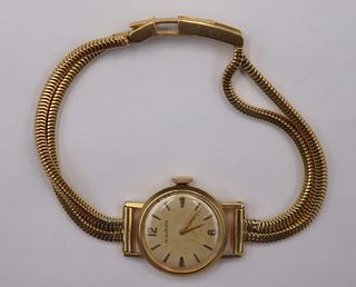 JEWELRY. Lady's Movado 18kt Yellow Gold Watch.