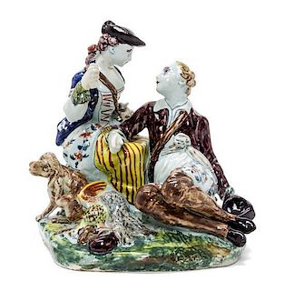 An 18th Century-Style Delftware Figural Group, Height overall 8 inches.