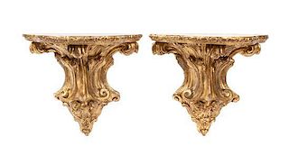 A Pair of Rococo-style Gilt Composition Brackets, Height 16 x width 17 inches.