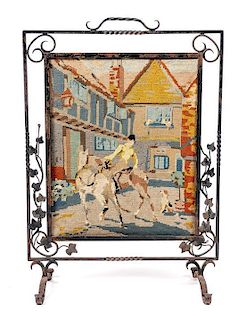 A Wrought Iron and Needlework Fire Screen, Height 31 1/2 x width 22 1/4 inches.
