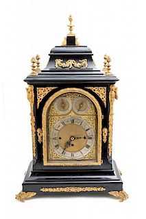 A Continental Black Lacquered Wood and Gilt Ormolu Mounted Mantel Clock, Height 29 x width 19 x depth 12 inches.