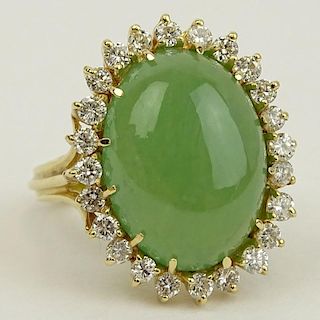 Vintage 14 Karat Yellow Gold Ring Set with Green Jade and Accented with Approx. 1.50 Carat Round Brilliant Cut Diamonds.