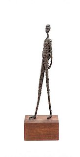 A Decorative Metal Sculpture of a Man, Height overall 21 1/8 inches.