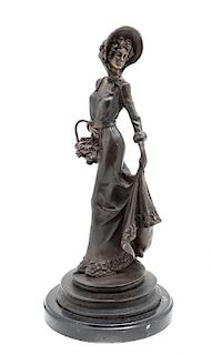 A Bronzed Metal Figure of a Woman in a Bonnet, Height 15 3/4 inches.