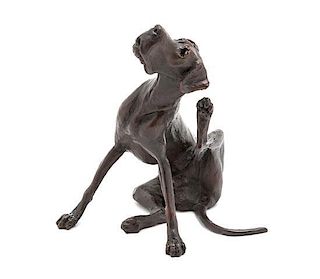 A Diminutive Bronze Figure of a Hound, Height 4 inches.
