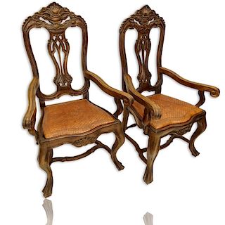 Pair of 20th Century Brazilian Portuguese Style Carved Wood and Tooled Leather Arm Chairs.