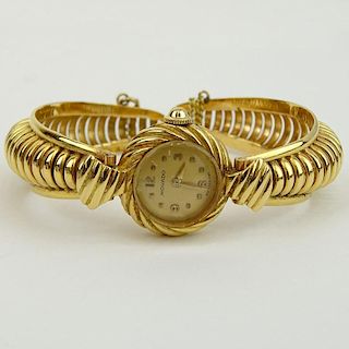 Lady's Vintage 14 Karat Yellow Gold Movado Bangle Bracelet Watch with Manual Movement.
