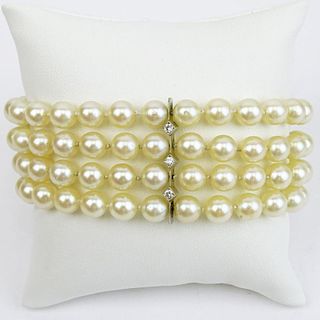 Vintage Four Strand Pearl, Diamond and 14 Karat White Gold Bracelet.