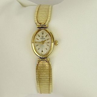 Lady's Vintage 14 Karat Yellow Gold Omega Bracelet Watch with Quartz Movement.