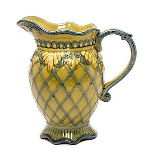 A Continental Glazed Pottery Ewer, Height 10 inches.