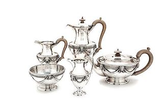 An English Silver Five-Piece Tea and Coffee Set Height of tallest 9 7/8 inches.