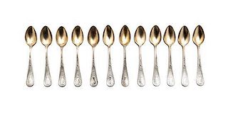 A Set of Twelve English Goldwash Silver Coffee Spoons, Length of larger 4 3/8 inches.