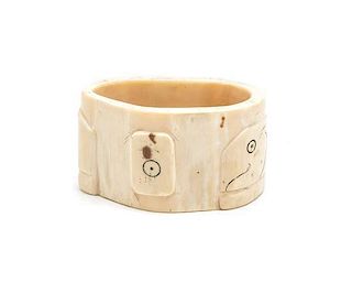 A Walrus Tusk Napkin Ring, Length 2 5/8 inches.