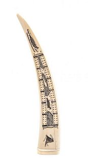 A Walrus Tusk Cribbage Set, Length 13 3/4 inches.