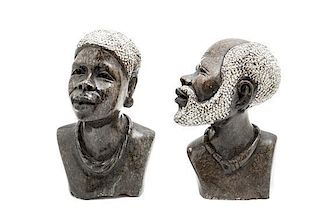 A Pair of Stone Carved African Style Busts, Height of taller 10 1/4 inches.