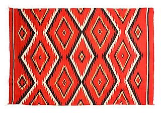 A Navajo Transitional Eye Dazzler Rug, 57 x 87 inches.