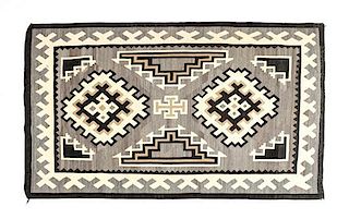 A Navajo Two Grey Hills Rug, 79 x 52 inches.