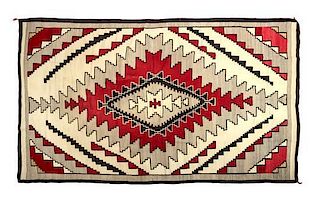 A Navajo Klagetoh Weaving, 119 x 73 inches.