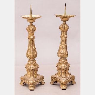 A Pair of Italian Baroque Gilt Brass Altar Candlesticks, 19th Century.