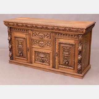 A Continental Heavily Carved Oak Cabinet, 20th Century.