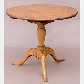 An American Walnut and Maple Tilt Top Tea Table, 19th Century.