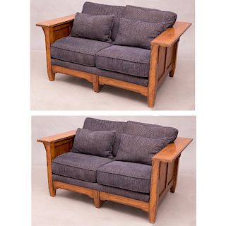 A Pair of Arts and Crafts Style Mahogany Settees, 20th Century.
