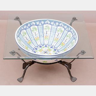 A Wrought Iron, Ceramic and Glass Low Table, 20th Century.