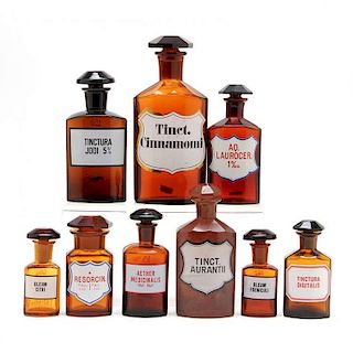 Group of Nine Similar Amber Glass Apothecary Bottles 