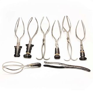 Eight Antique Obstetrical Forceps 