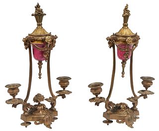 Pair of Gilt Bronze and Porcelain Candelabra, 19th c., with a central lidded porcelain perfume cup in a garland mount, raised on two curved arms termi