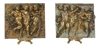 Pair of Continental Gilt Bronze High Relief Plaques, early 20th c., depicting a procession of frolicking putti, together with two modern brass stands,
