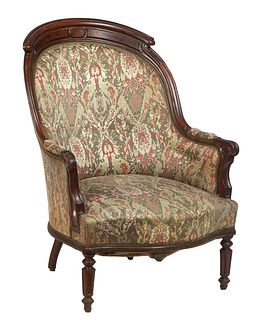 French Louis XVI Style Carved Walnut Bergere, 19th c., the arched canted curved cushioned back to rolled scrolled upholstered arms over a bowed uphols