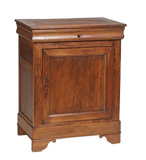 French Provincial Louis Philippe Carved Walnut Confiturier, early 20th c., the rectangular top over a frieze drawer and a large cupboard door, on a pl