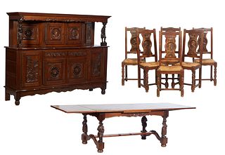French Provincial Eight Piece Figural Carved Oak Dining Room Suite, 20th c., Brittany, consisting of a sideboard, 6 chairs and a drawleaf dining table
