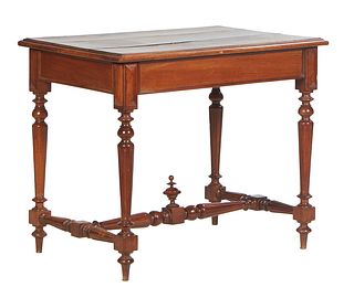 French Carved Walnut Henri II Style Writing Table, 19th c., the stepped top over a wide skirt, on turned tapered and block trestle supports, joined by