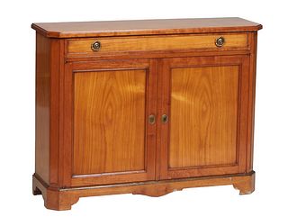 Diminutive English Style Carved Cherry Sideboard, 20th c., the ogee edge canted corner top over a long frieze drawer above setback double cupboard doo