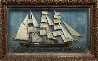 Carved Wood Diorama, 19th c., of a clipper ship in full sail, presented in a gilt and gesso shadowbox frame, Frame- H.- 22 1/4 in., W.- 35 in., D.- 7 