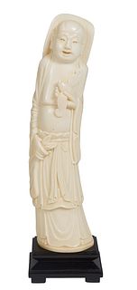 Chinese Carved Ivory Standing Hotei Figure, early 20th c., on an ebonized stand, Figure- H.- 10 1/4 in., W.- 2 3/8 in., D.- 2 1/8 in.