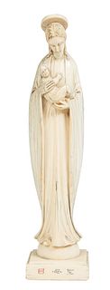 Chinese Carved Ivory Madonna and Child, early 20th c., on an integral rectangular plinth, with a scrimshaw signature on the front of the plinth, H.- 7